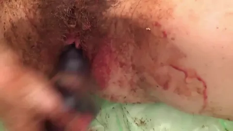 The girl is all in her shit and smears herself shit
